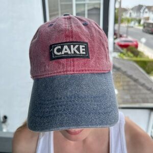 Baseball cap with sewn on Cake patch